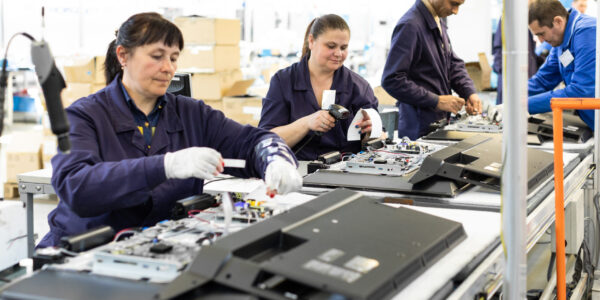 Workshop on assembling telephysics. Testing TVs in the workshop. Electronics assembly line.