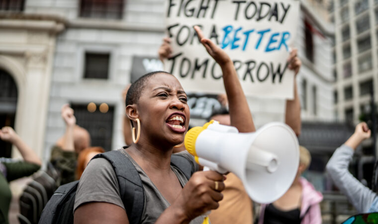 Activists doing a demonstration outdoors
